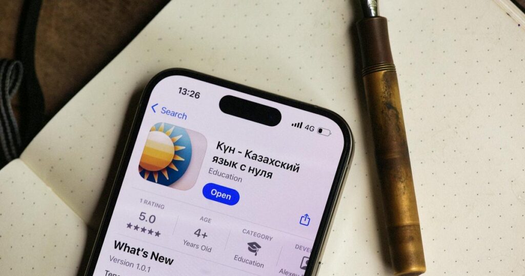 Smartphone with Spanish language learning app on screen