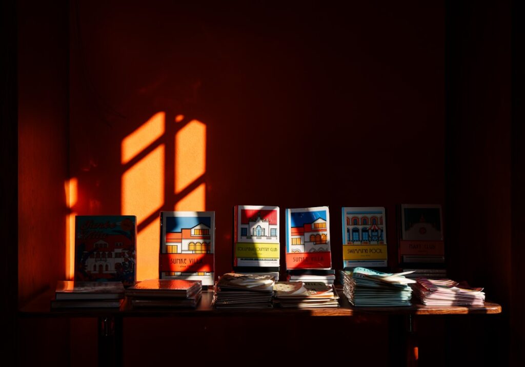 Contemporary Spanish novels on a bookshop table in warm light