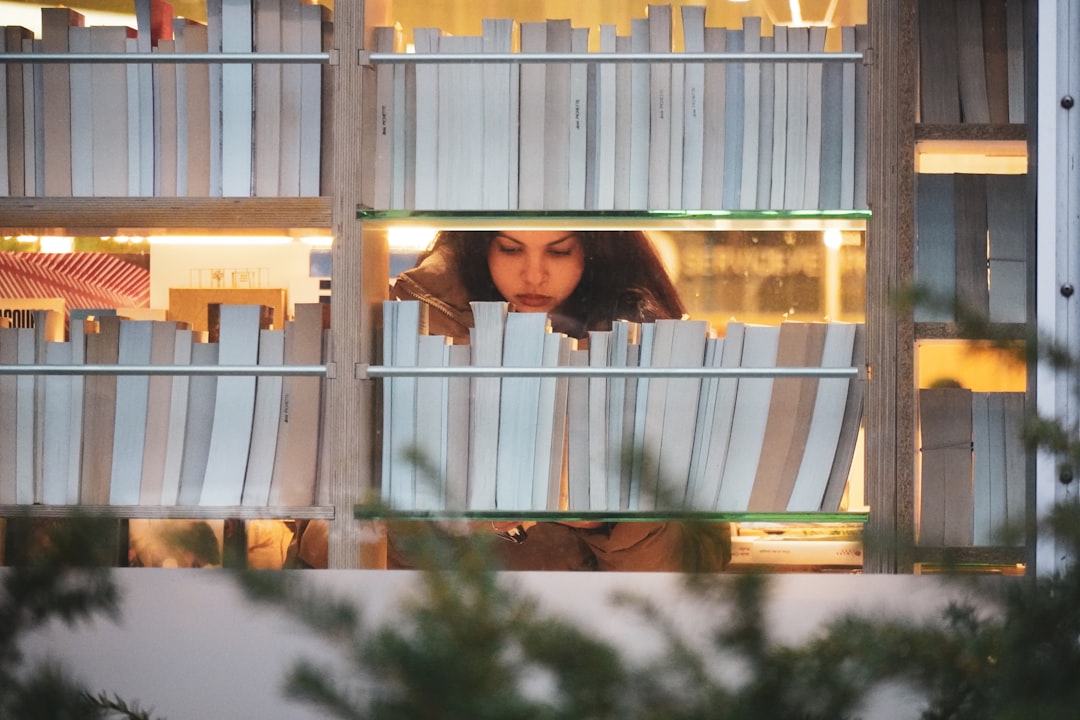 A reader browsing shelves in a bookshop