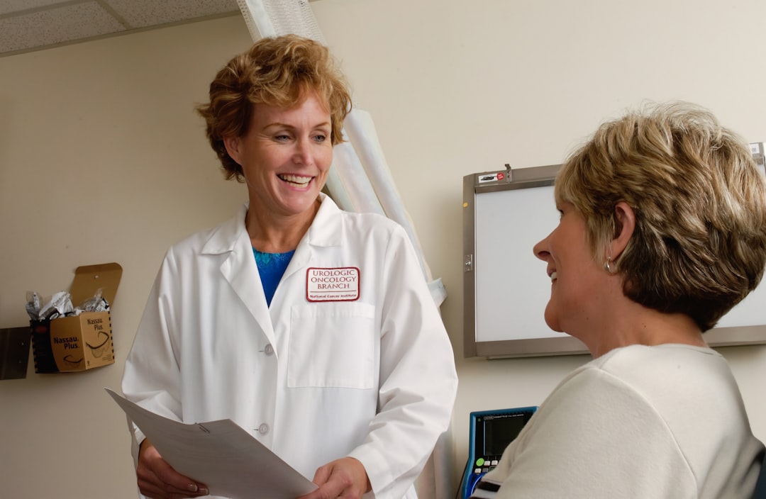 Doctor speaking with a patient in a clinic consultation room