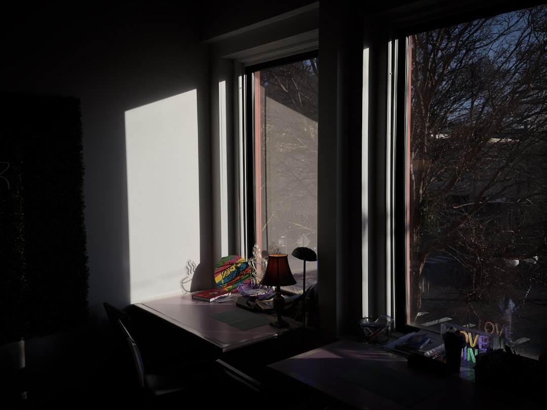 A notebook and pencil on a quiet desk in morning light, the everyday setting of slow Spanish practice