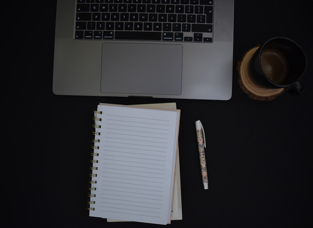 Notebook and coffee on a desk for studying the Spanish subjunctive